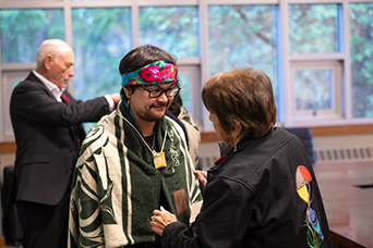 An Indigenous student receives graduating regalia at RRU. This image links to Indigenous student experience information.