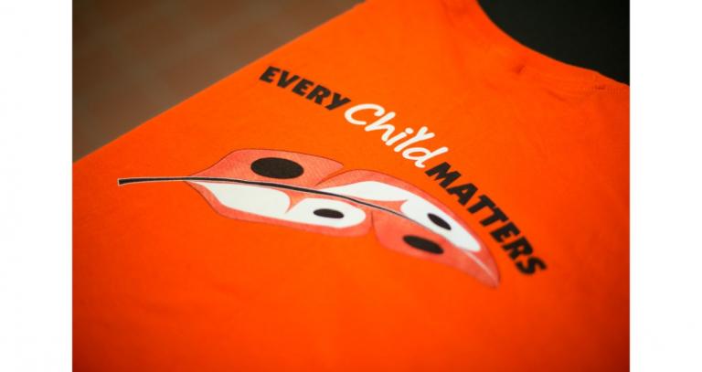 Orange-shirt-with-words-Every-Child-Matters-and-feather
