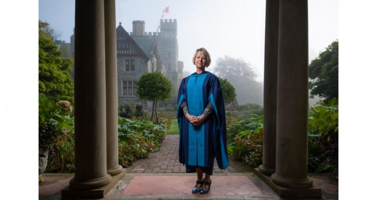 Bonnie-Henry-standing-at-Royal-Roads-University-in-Convocation-gown