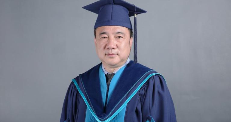 Dr. Weichang Yang wearing Royal Roads convocation regalia.