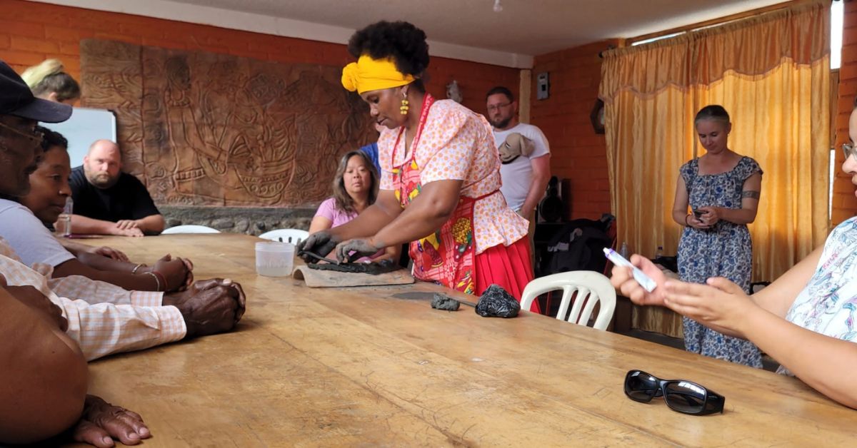 Watching a clay mask making demonstration.