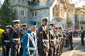 Canadian Armed Forces members stand in a row in front of Hatley Castle. This image links to CAF information.