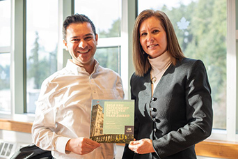 Two people post at RRU for an Internship award photo