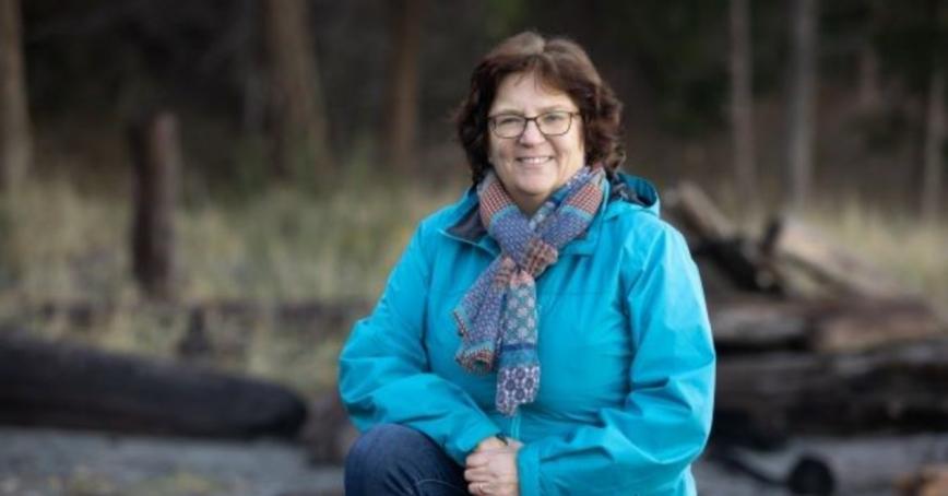Jacquie Gilson sitting outside.