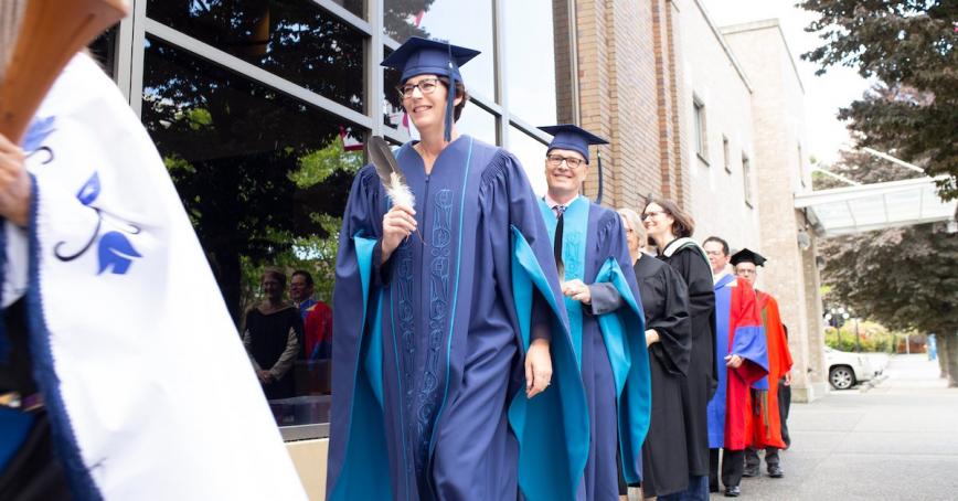 President Philip Steenkamp walking in full regalia.