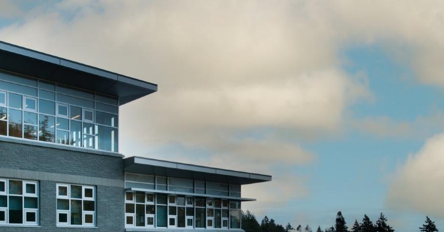 Scenic photo of a building on campus on a cloud day