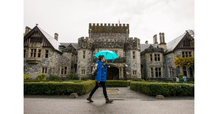 student-with-umbrella-in-front-of-Hatley-Castle