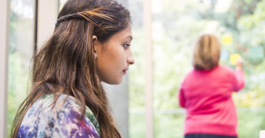 Two students working in the library.