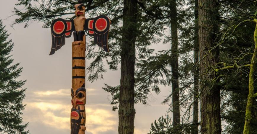 S'ael Pole at edge of forest.