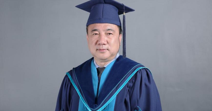 Dr. Weichang Yang wearing Royal Roads convocation regalia.