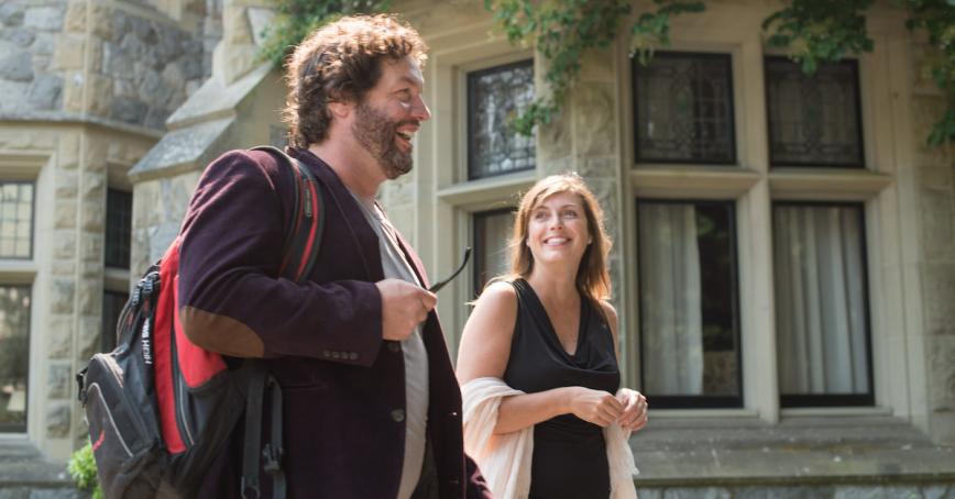 Two students walking outside Hatley Castle.