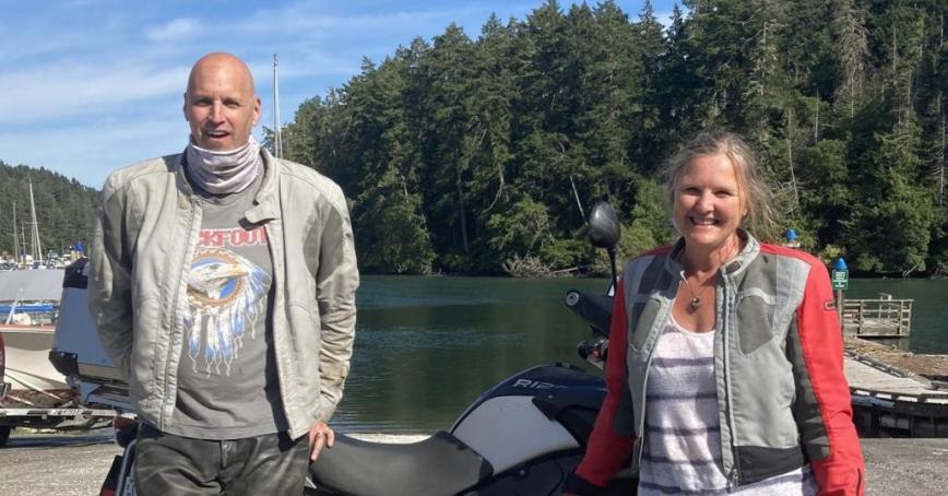 Andreas, left, and Carolann Gneist with their motorcycle.