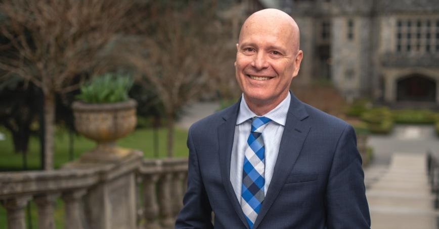 President Steenkamp smiling in front of Hatley Castle