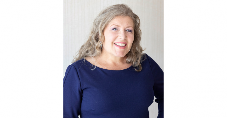 Smiling woman in navy blue shirt