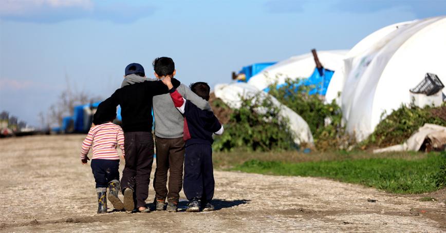children walking on dirt road