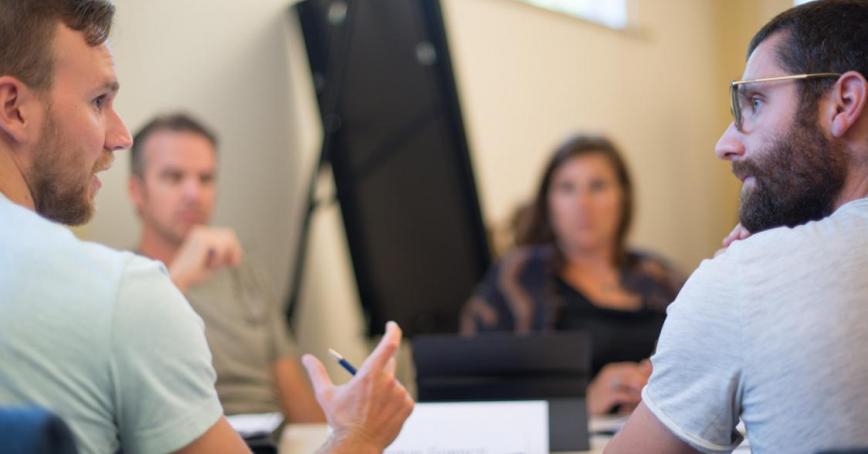 group of students around table