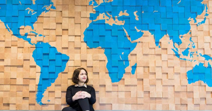 women infront of map