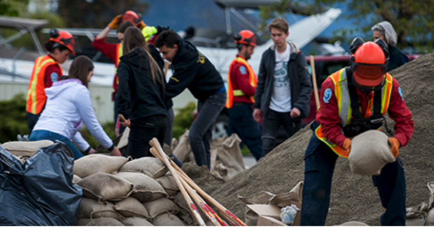 people clearing rubble