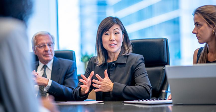 People sitting around a boardroom table