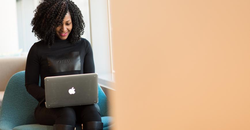 person sitting with laptop 
