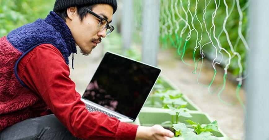 Student in a lab using a laptop