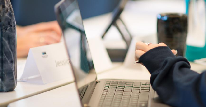 person typing on laptop