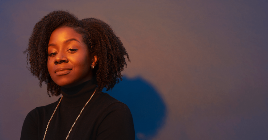 Sandy Hudson against a shadowy purple background. 