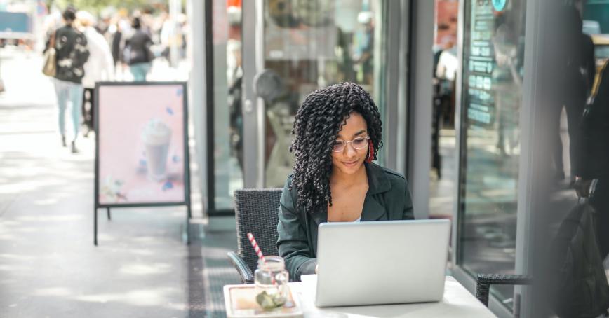 Someone looking at a laptop