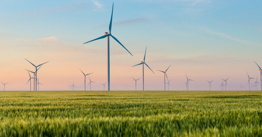 Windmills standingin a field