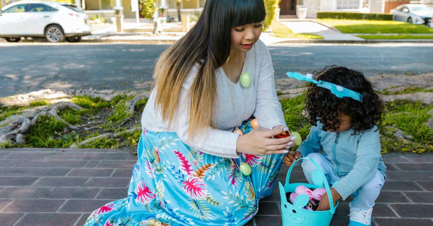 A woman and child with an Easter egg basket. 
