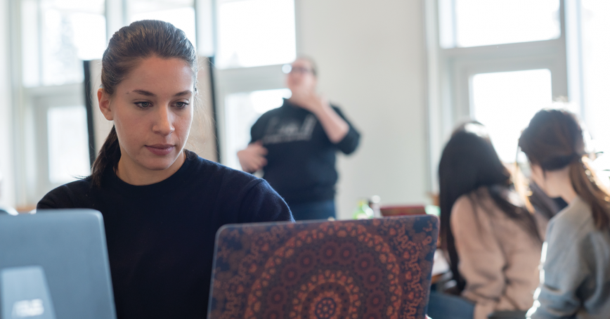 woman reading on laptop