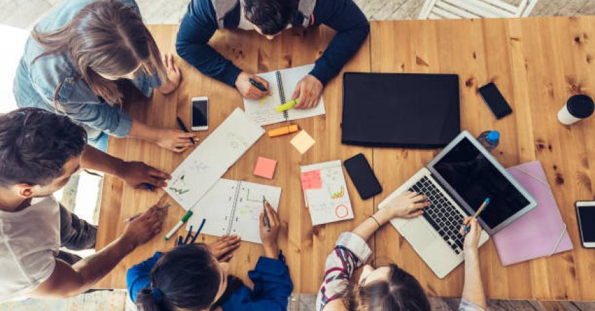 Group of students of project management studying 