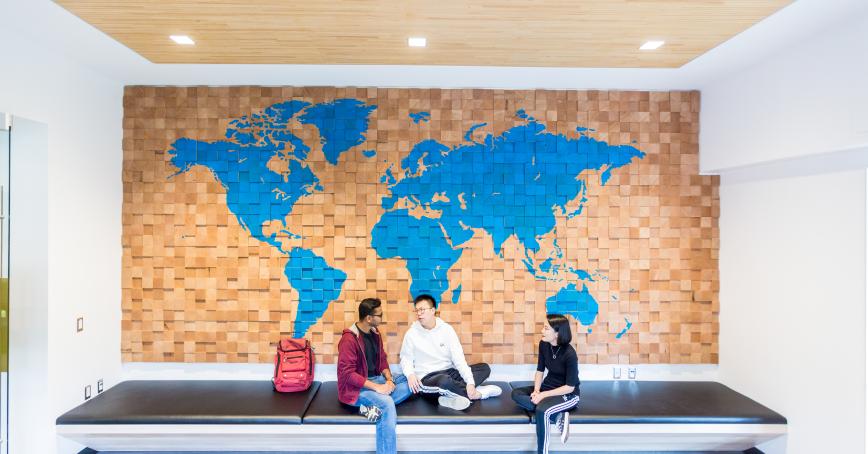 students sitting infront of a map