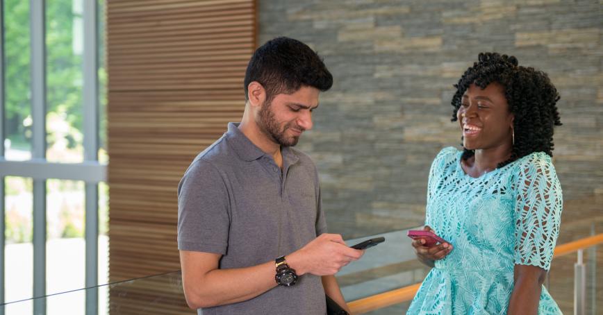 students talking in campus building
