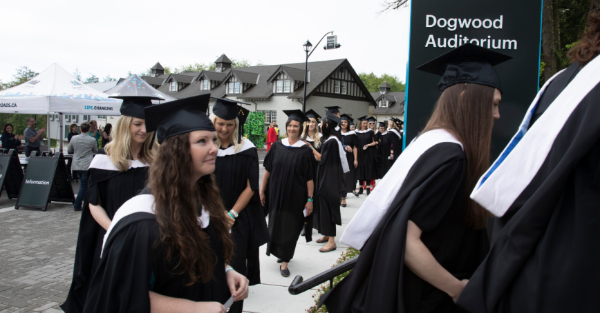 Graduates file in to the Dogwood Auditorium for Spring 2022 Convocation.