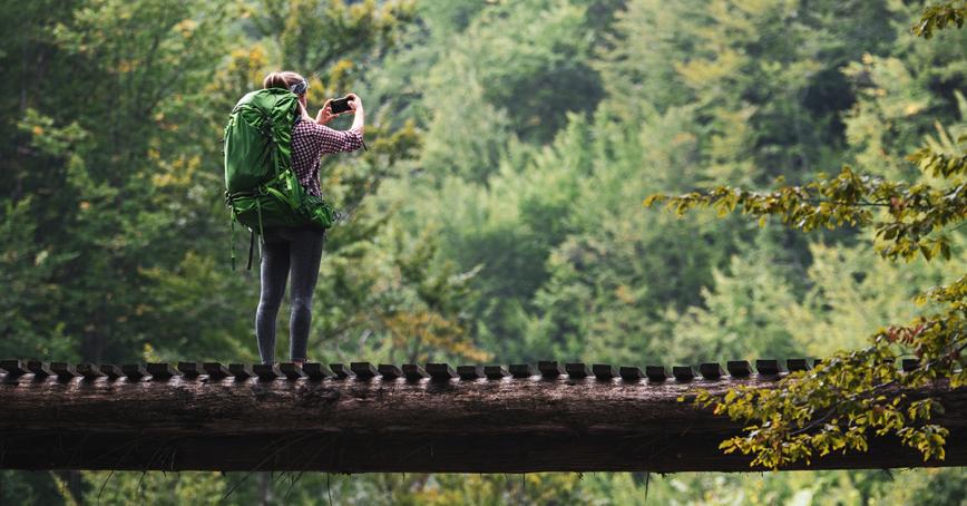 A student in nature taking pictures