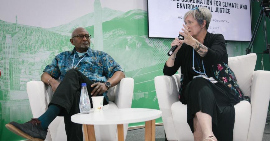 Deb Morrison(right) speaks with Dr. Robert Bullard (left) on strategic coordination for climate and environmental justice