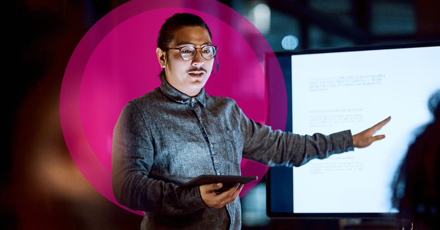 Instructor giving a lecture on a smart board.