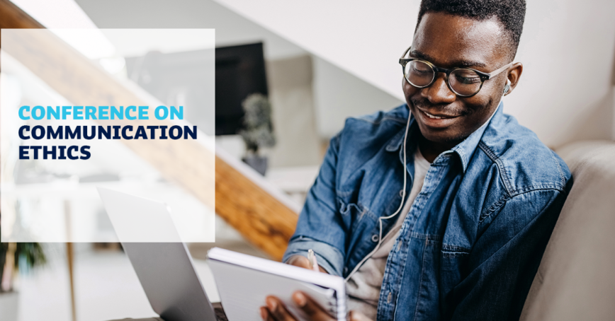 A man smiles while taking notes with a pen and paper. The words, "Conference on Communications Ethics" appear to the left.