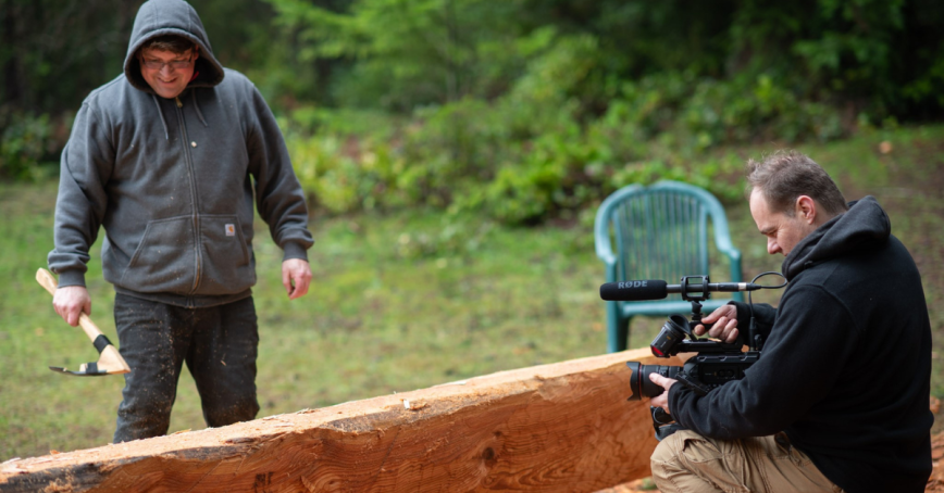 Prof. Vannini films carver Beau Wagner as he works on a dug out canoe.