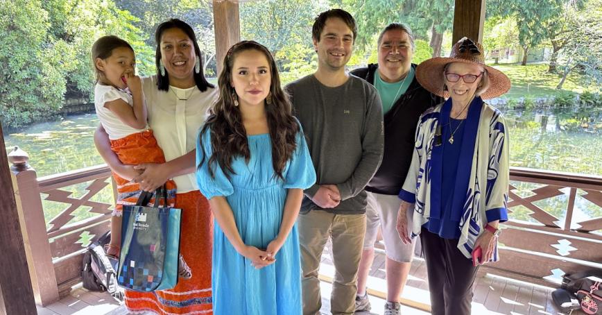 The graduates and faculty members in the Japanese Gardens at Royal Roads.