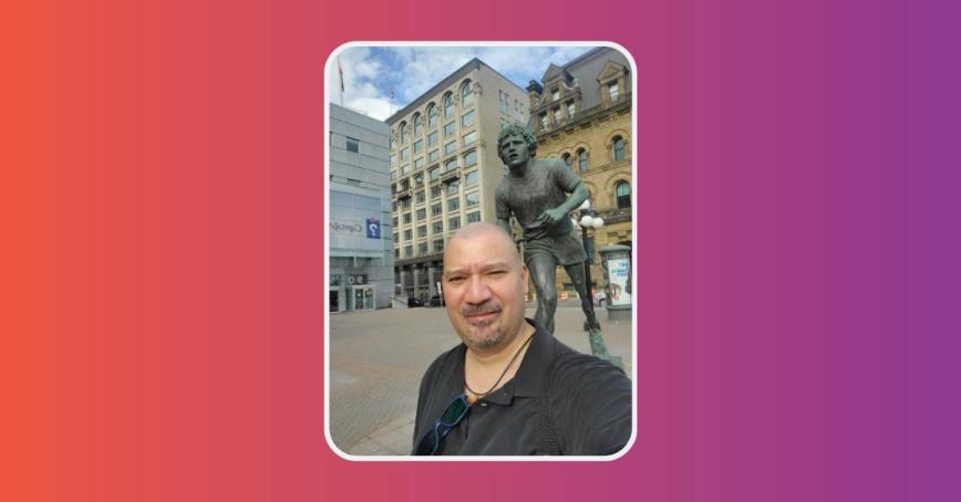 Walter Alvarez standing in front of the Terry Fox statue