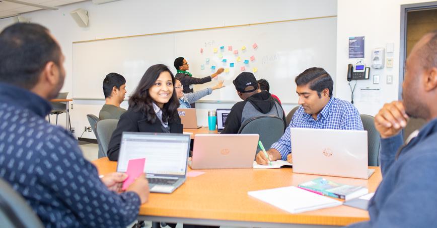 Students talking in a classroom