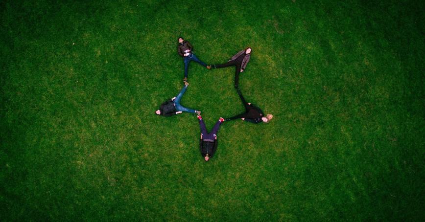 a group of people holding hands