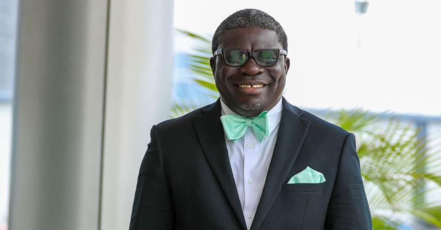 Edward Appiah-Brafoe wearing a tux and smiling outside