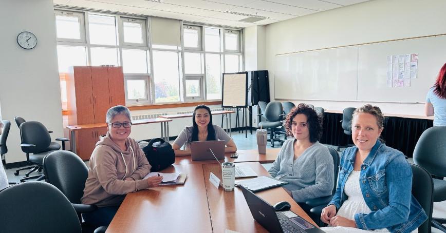 Jessie Zhang and classmates sitting at desks.