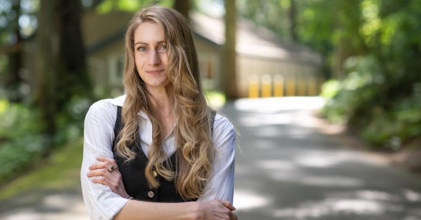 Rebecca Pearce smiling with the Cascade Institute building behind her.