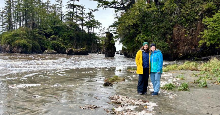 Professors Rebecca Wilson-Mah and Ann-Kathrin McLean stand on a beach.