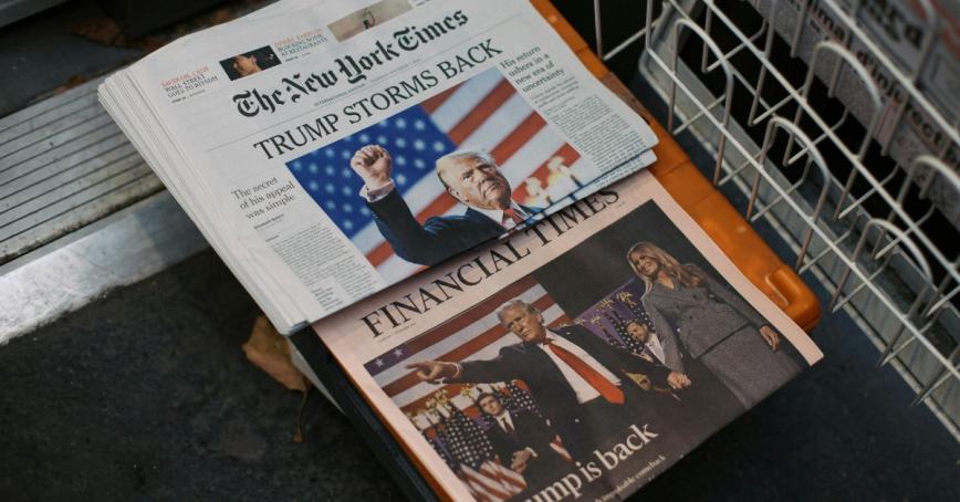 New York Times newspaper displays "Trump storms back" on front page headline.