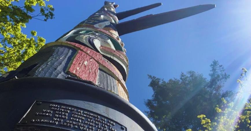 An image of a totem pole, taken from the base of the pole